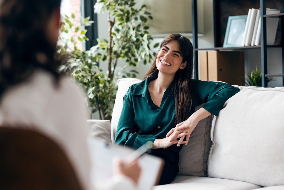 Woman smiling during a conversation with a clinician